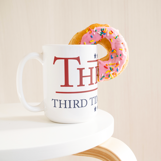 Thrump_-_Third_Times_a_Charm_15oz_Coffe_15ozWhiteMugLifetsyleDonutLH_Mockup.png